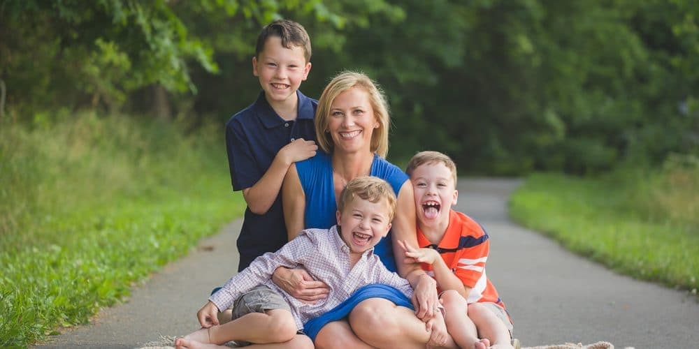 mother with her three sons in a family photo by Rebecca Danzenbaker